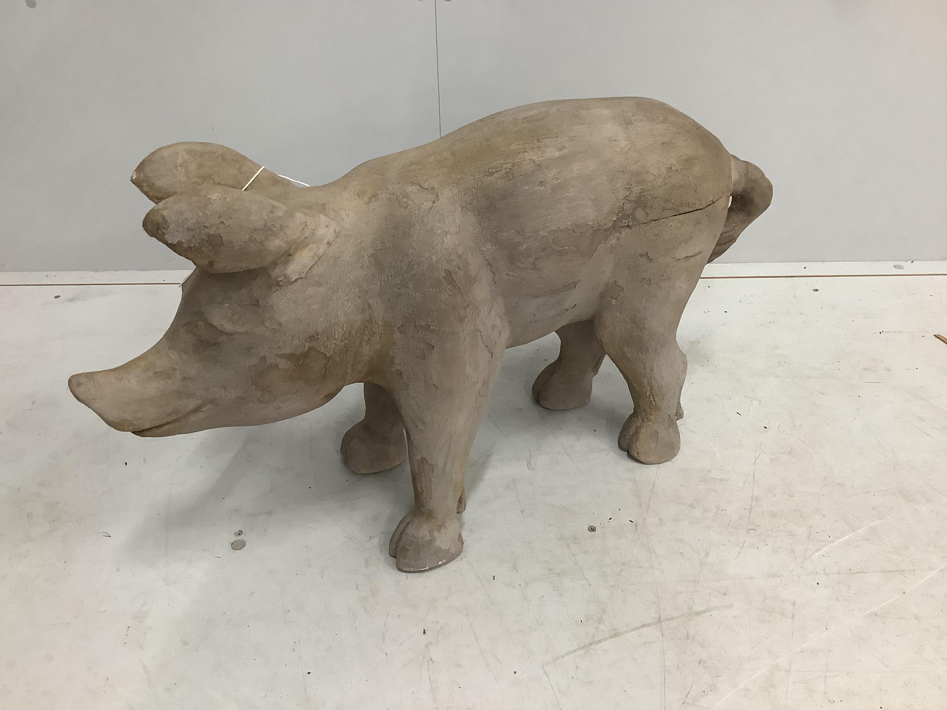 A carved wood model of a standing pig, length 82cm